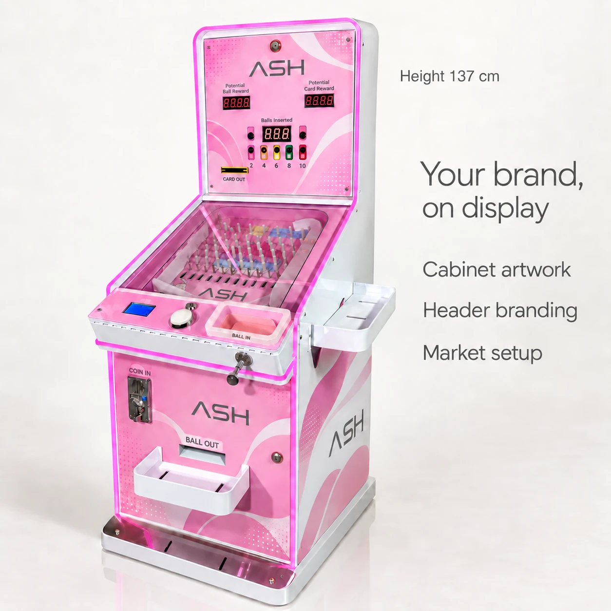 Pink and white cabinet with ASH exterior artwork, unchanged control layout, side tray and front basket.