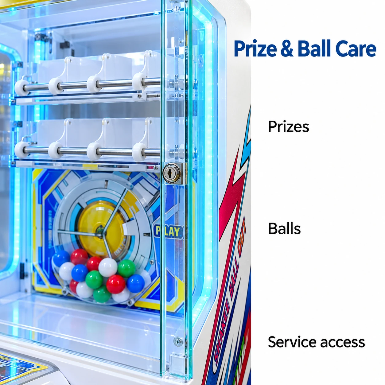 Close view of the closed glass prize display, exterior lock and prize rails with the ball chamber softly visible behind.